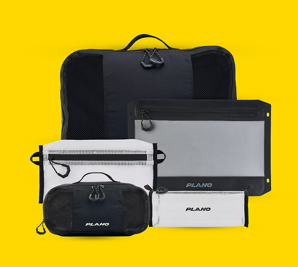 Collection of black and white bags with 'Plano' branding on a yellow background
